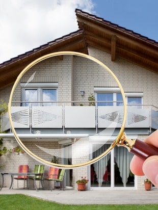 gold magnifying glass zooming in on home windows
